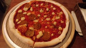 Half vegan pepperoni pizza and garlic and tomato at Slices in Osaka