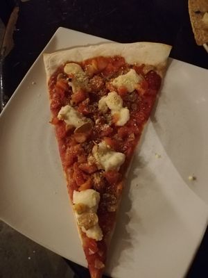 Slice of vegan "pepperoni" pizza at Slices in Osaka