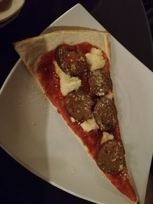 Slice of vegan pepperoni pizza at Slices in Osaka