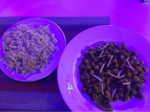 Chickpea curry with fresh sliced ginger served with brown rice at Taj Mahal  in Oaxaca