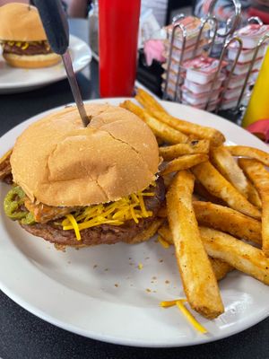 Vegan S-Curve Popper Burger with Beyond patty and side of fries.  Burger topped with grilled jalepenos, vegan bacon, vegan cream cheeze, and vegan mayo at Ocala's Downtown Diner in Ocala