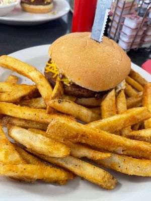 Vegan S-Curve Popper Burger with Beyond patty and side of fries.  Burger topped with grilled jalepenos, vegan bacon, vegan cream cheeze, and vegan mayo at Ocala's Downtown Diner in Ocala