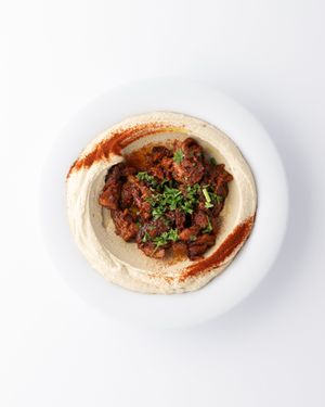 BBQ meatless chicken Hummus Bowl:
serve with pita, side of shredded carrots, red cabbage, schug.
 at The Hummus House in Fort Lauderdale