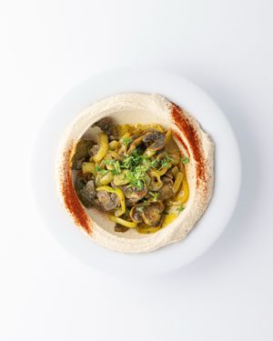 Mushrooms Hummus Bowl:
serve with pita, side of shredded carrots, red cabbage, schug.
 at The Hummus House in Fort Lauderdale