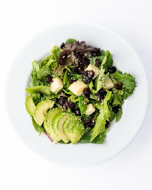 Spring Salad: spring mix green, lettuce, cranberries, hearts of palm, avocado, sesame seeds, agave garlic vinaigrette. at The Hummus House in Fort Lauderdale