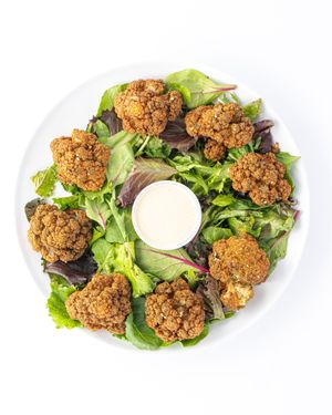 Crispy Cauliflower in a Zahatar , serve with Tahini sauce.  at The Hummus House in Fort Lauderdale