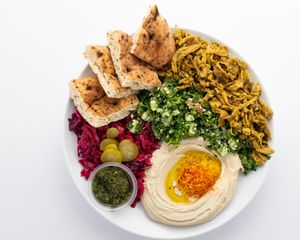 Shawarma Platter:
serve with tabbouleh salad, hummus, pita, red cabbage, pickles, schug( hot sauce) at The Hummus House in Fort Lauderdale