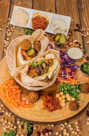 Our amazing meatless Shawarma in a pita pocket. Next to the shawarma pita pocket is our falafel pita pocket.  at The Hummus House in Fort Lauderdale