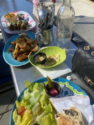left to right: falafel tacos, potatoes, vegan wrap w/ salad  at Les Amis Restaurant in Fullerton