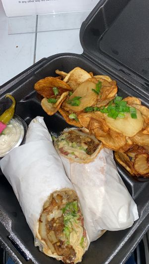 cauliflower wrap w/ potatoessss  at Les Amis Restaurant in Fullerton