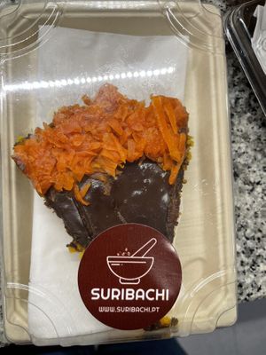 Bolo de cenoura com cobertura de chocolate e doce de cenoura por cima. Delicioso!  at Suribachi in Porto