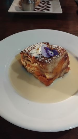 Apricot bread and butter pudding and custard. at The Brit in Port Talbot