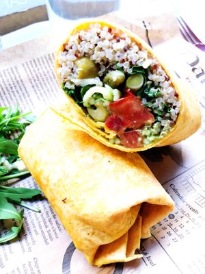 Wrap with quinoa, kale, tomatoes and olives  at Cocome in Sevilla