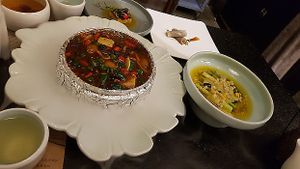 Spicy tofu & veg, hot but served in dry ice?! at Qian Yue Ming in Chongqing