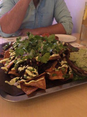 Vegan nachos with black beans, pickled jalapeño, green onion, guajillo, cilantro, scallion crema. Yum!  at Bent Taco in Collingwood