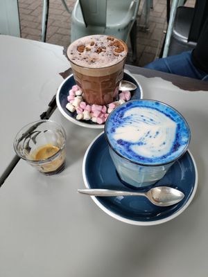 Fancy drinks. Biscoff hot chocolate and lavender spirulina latte at East Village Cafe in Bristol