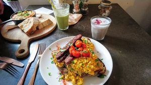 Scrambled tofu with tempeh, shakshuka, green smoothie and blue skies latte at East Village Cafe in Bristol