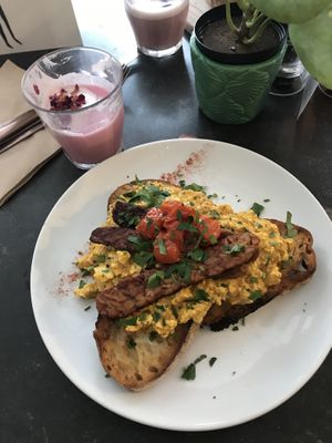 Tofu scramble and pink pitaya latte  at East Village Cafe in Bristol