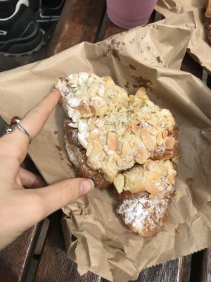 Almond croissant  at East Village Cafe in Bristol