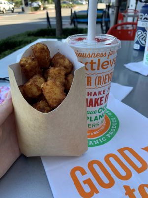 Tots and a strawberry shake! 🍓 at Next Level Burger - Concord in Concord
