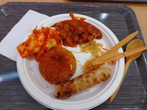 Gulash, kimchi, nem, fried mushed potato at Loving Hut - Spalena in Prague