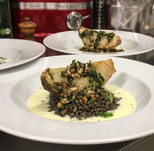 Roasted celeriac with a caper and almond sauce and green lentils  at Le Local in Brussels