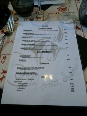 one side of the menu at Le Petit Chamois in Isola