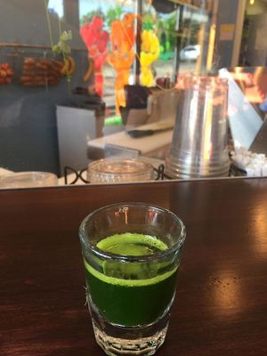 Wheatgrass shot! at Wild Blue in Grand Haven
