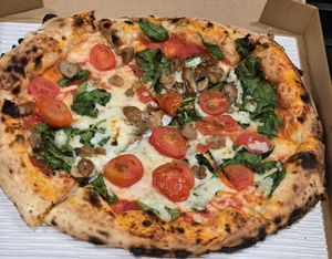 Gabriele: vegan cheese, spinach, cherry tomatoes, mushrooms at Officine Buona Forchetta in San Diego