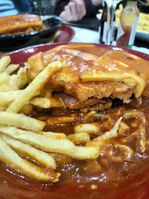 Francesinha being devoured at Casanova in Porto