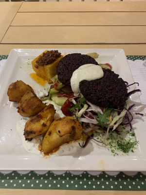 Special vegetarian plate (off menu item recommended by the waiter): polenta, roast potatoes, grilled vegetables, salad, 2 beetroot burgers  at Klopa in Sarajevo