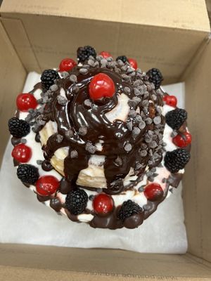 Vegan special edition chocolate Black Forest cake with cinnamon roll on the top!   at Happy Zoe Vegan Bakery in Brooklyn