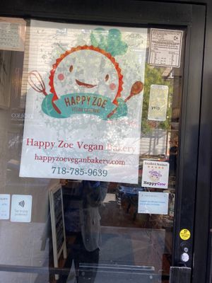 Front door, with Happy Cow sticker at Happy Zoe Vegan Bakery in Brooklyn