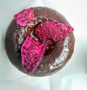 Dragon fruit and chocolate donut at Happy Zoe Vegan Bakery in Brooklyn