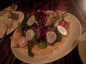 CAST IRON SOCCA. (MARKET GREENS. GREEN HERB PUREE. AVOCADO. ) at XYST in New York City