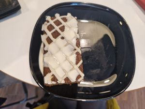 Warm gingerbread cake with cream at Hillgate Cakery in Stockport