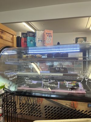 Sweets cabinet and milk options  at Lucky Cat Cafe in Annerley