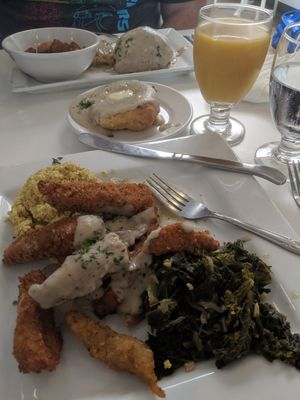 Country breakfast with a side biscuit and gravy. at Three Carrots - Fountain Square in Indianapolis