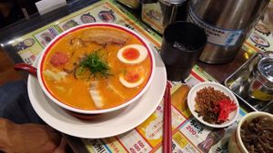 One of the non vegan options with burned garlic on the side at Kyushu Jangara Ramen - Ginza in Tokyo