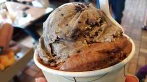 Vegan tripple threat chocolate beneath oat cookies and cream ($5). Neither are good. Both taste artificial & have an unpleasant buttery flavor. at Batavia Creamery in Batavia