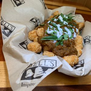Curry Tots: Yellow Curry, Lentils, Coconut Crema, Cilantro, Green Onions (Kalamazoo Vegan Chef Challenge 5/25) at Bell's Brewery in Kalamazoo