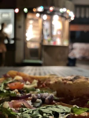 Kalapizza pizza corner on the street with tables outside 😋  at Kalapizza in Wroclaw