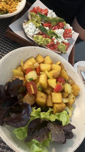 Roasted potatoes, with avocado and creamy sauce toast, and tofu scramble.  at Goodsouls Kitchen in Chiang Mai