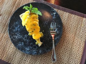 Mango Passionfruit Cheesecake - yummy, but the base was way too course. The almonds could’ve been ground up even more.  at Goodsouls Kitchen in Chiang Mai