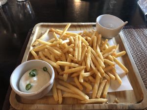 A good serving size of fries with a yummy side sauce  at Goodsouls Kitchen in Chiang Mai