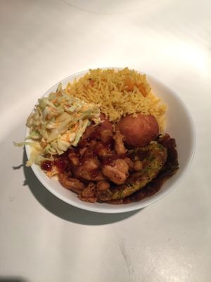 Fritters, dumplings, southern fried jackfruit, coleslaw and rice  at Deserted Cactus in South East London