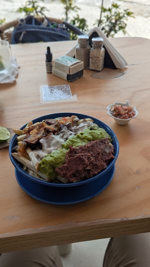 Papas bravas with lots of sauces at Cherry's Cocina in Pereira