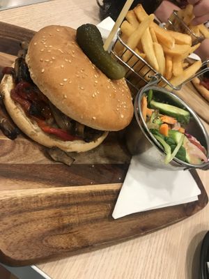 Vegan burger w/ chips and salad. Amazing taste.  at Whispers Cafe in Parramatta