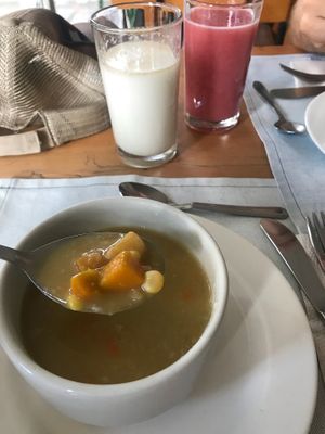 Oat milk and strawberry passion fruit juice. Soup of the day: pumpkin, corn and plantain. at El Arbol de la Vida - Maybe closed in Medellin