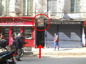 alleyway, below the Avis Tailors sign at Gautam Sweets - Tip Top in Kathmandu